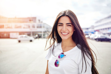 Beautiful woman with sunglasses on shirt
