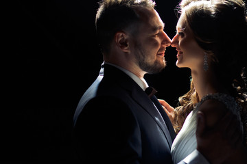 Charming smile of the bride next to a groom