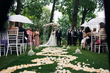 Way to the wedding arch with the rose petals