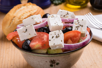 greek salad on wooden table