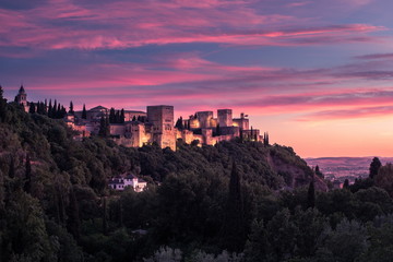 Beautiful sunset view of Spain's main tourist attraction, ancient arabic fortress of Alhambra, Granada, Spain