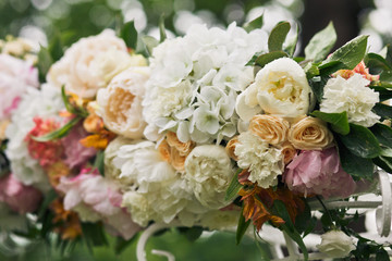 Fototapeta na wymiar Lovely flowers on the wedding arch for the ceremony