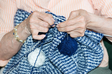 Detail of a person knitting