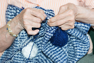 Detail of a person knitting