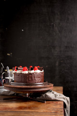 Fototapeta na wymiar Strawberry Chocolate Cake on vintage wooden background. Dark foo