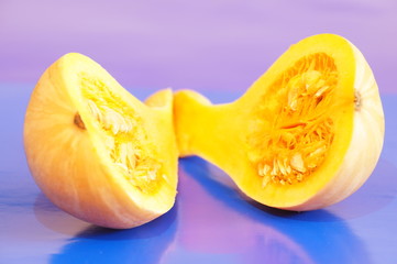 Yellow and ripe pumpkin lie on a bright background
