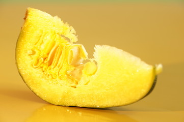 Yellow and ripe pumpkin lie on a bright background
