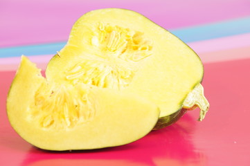 Yellow and ripe pumpkin lie on a bright background
