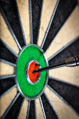 dart in bull's eye, close up