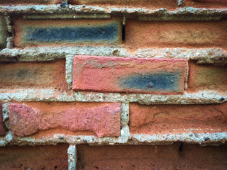 red brick wall texture grunge background with vignetted corners