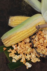 Popcorn with butter and fresh corn cob.