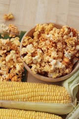 Popcorn with butter and fresh corn cob.