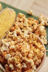 Popcorn with butter and fresh corn cob.