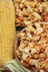 Popcorn with butter and fresh corn cob.