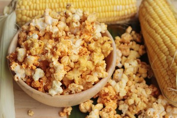 Popcorn with butter and fresh corn cob.