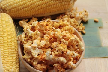 Popcorn with butter and fresh corn cob.
