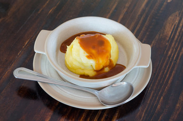 Mashed potatoes with cheese on the table