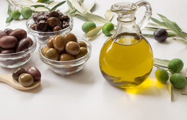 Premium virgin olive oli and variety of olives.