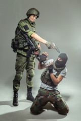Russian soldier fighting against a terrorist