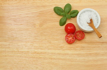 Salt tomatoes and basil