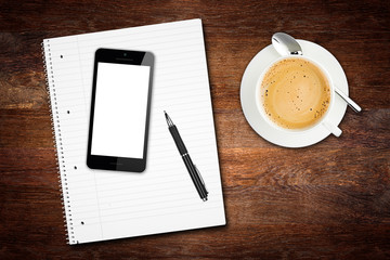 office business dektop wood background with smartphone coffee cup pen and note pad