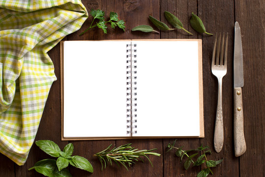  Blank cooking recipe book on a wooden table