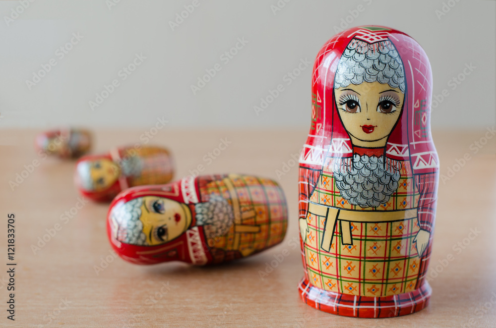 Wall mural Red matryoshka. Blurred background. Close-up