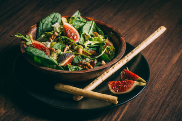 Healthy salad with lettuce, figs and nuts