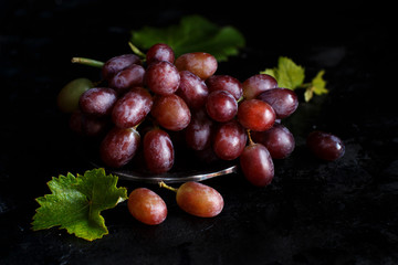 Red grapes on a dark Background