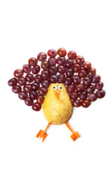 Food art creative concepts.  Funny animal made of fruits, such as pear and grapes isolated over white background 