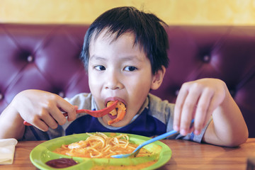 Portrait of adorable little child having lunch