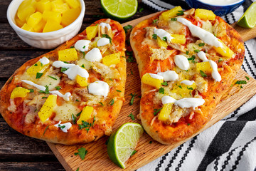 Homemade hawaii Flatbread Pizza with chicken and pineapple dressing yogurt sauce.