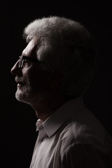 Eyewear concept. Profile portrait of 60-year-old man posing