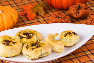 Fresh baked homemade beef pumpkin pinwheels.