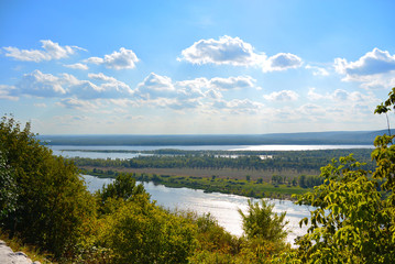 Fototapeta na wymiar Panoramic view from the hill on the the Volga river near Samara city at sunny day. Beautiful natural landscape. Russia.
