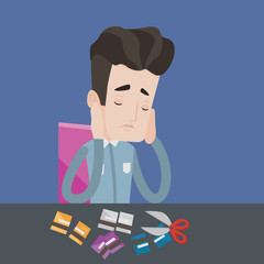 Businessman bankrupt cutting his credit card.