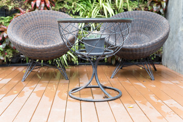 rattan wicker chair and desk on patio