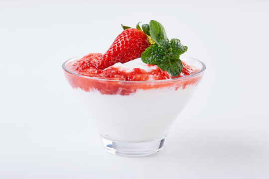 greek youghurt and strawberry in a glass cup