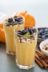 Pumpkin smoothie with granola and berries