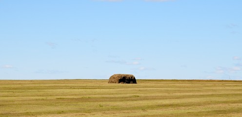 Obraz premium Autumn rural landscape - haystacks in a field