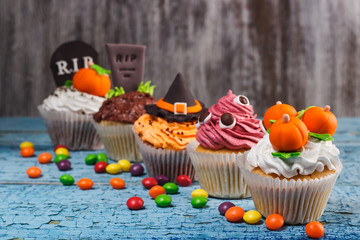 Halloween cupcakes with colored decorations