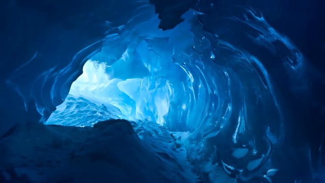 Blue Ice cave. Slow motion 4K footage