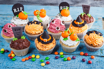Halloween cupcakes with colored decorations