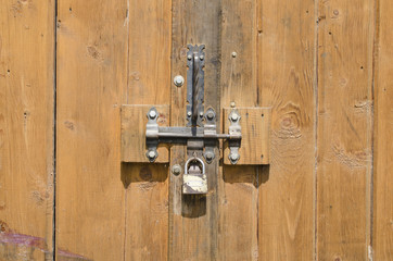 padlock on a wooden old door
