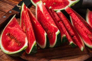Slices of ripe watermelon lying on the board