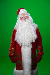 Дед Мороз, Санта Клаус или Пер Ноэль в красном костюме на зеленом фоне