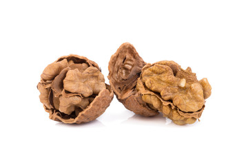walnut and a cracked walnut isolated on the white background