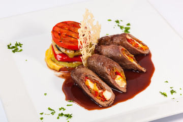 meat rolls with sauce and vegetables cheese