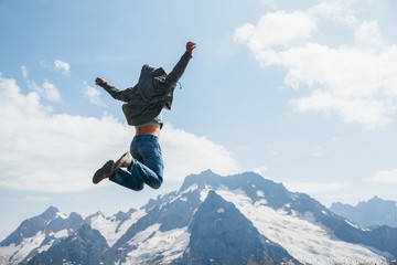 Fototapeta na wymiar Man jumping on mountain