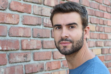 Close up of a handsome bearded man with copy space